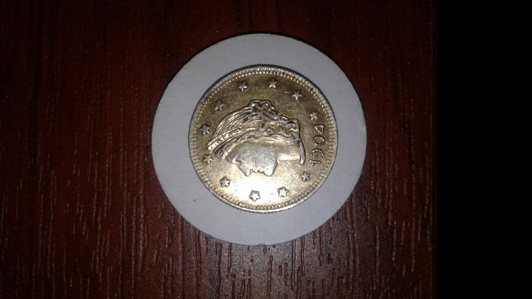 Photo 2 Pièce de monnaie non identifiée: Moneda estadounidence