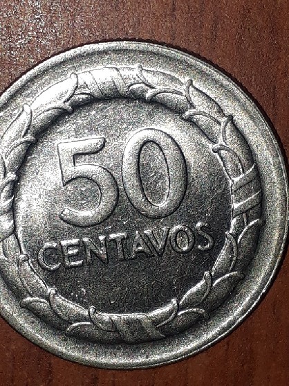 Photo 2 Pièce de monnaie non identifiée: moneda de 59 centavos de 1967 de colombia con error