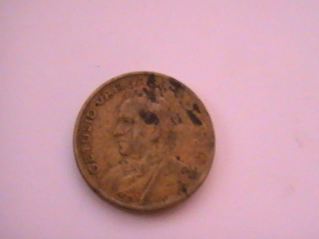 Photo 1 Pièce de monnaie non identifiée: getulio vargas 50 centavos 1945