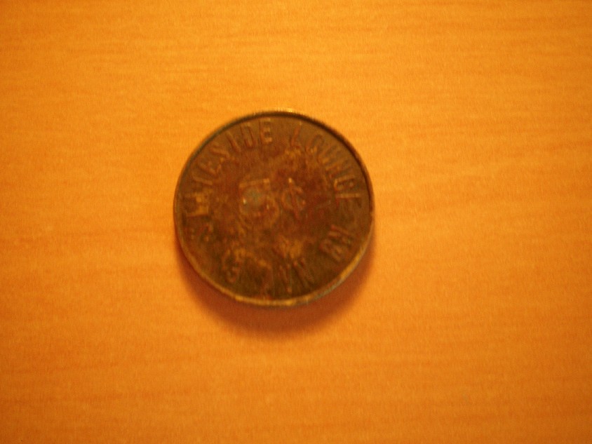 Photo 1 Pièce de monnaie non identifiée: Moneda o Ficha? (5 cents)