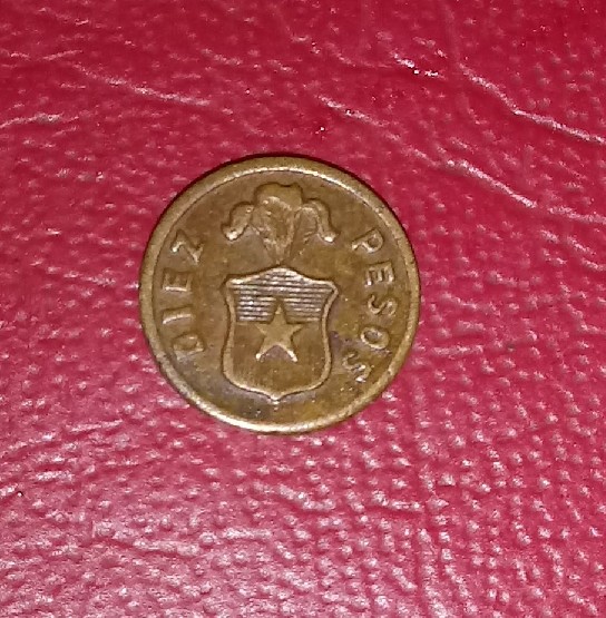 Photo 1 Pièce de monnaie non identifiée: Ayuda, moneda chile 10 pesos sin fecha