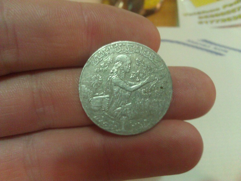 Photo 1 Pièce de monnaie non identifiée: Alguna idea??