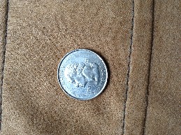 Photo 1 Pièce de monnaie non identifiée: 25 centavos de dólar Georgia