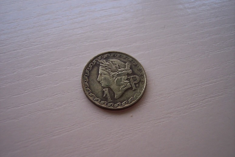Photo 1 Pièce de monnaie non identifiée: Es moneda o ficha