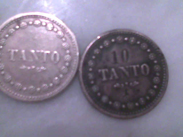 Photo 2 Pièce de monnaie non identifiée: TANTO y 10 TANTO