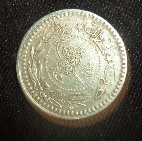 Photo 2 Pièce de monnaie non identifiée: moneda árabe de 5??? 