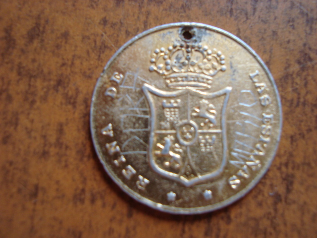 Photo 2 Pièce de monnaie non identifiée: es una moneda? 